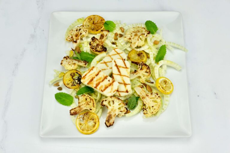 beautifully plated Roasted Cauliflower & Halloumi Salad with Fennel and Grilled Lemon