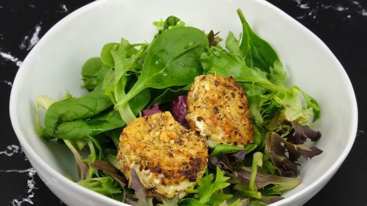 a bowl of warm chevre salad