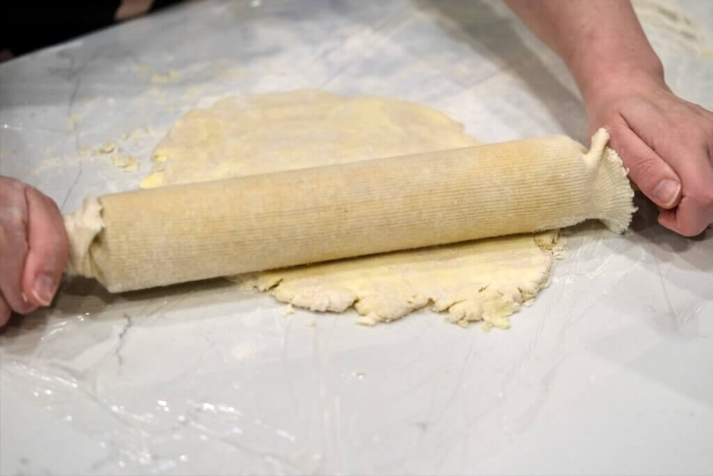 rolling out flaky homemade pie crust