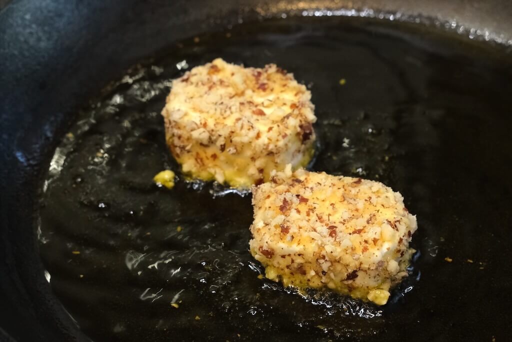 frying coated goat cheese medallions for chevre salad