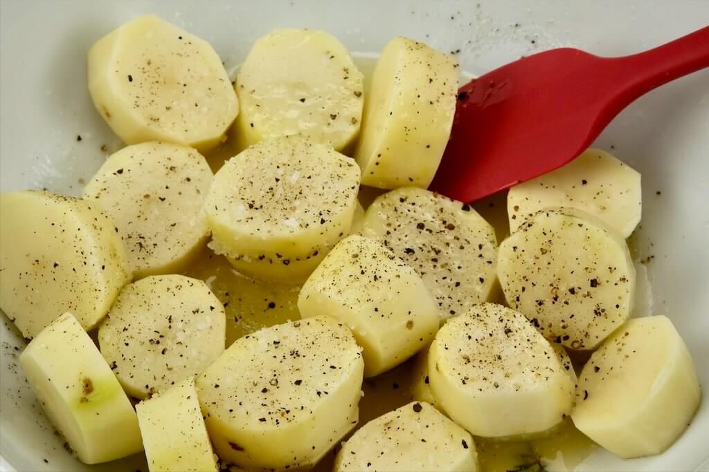 potatoes tossed in the melted butter, duck fat, herbs, salt, and pepper