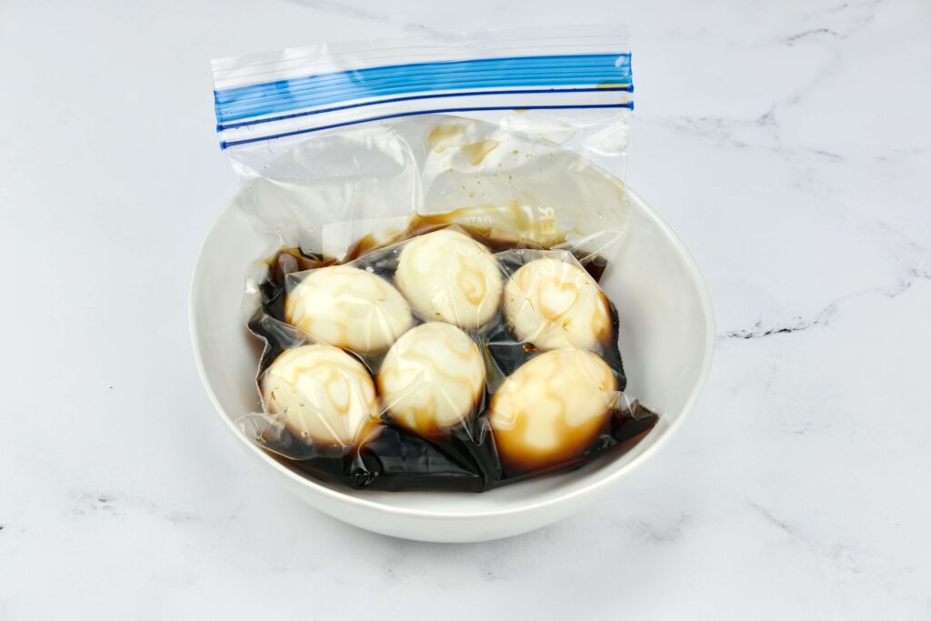 eggs marinating in a freezer bag of soysauce, water, and mirin