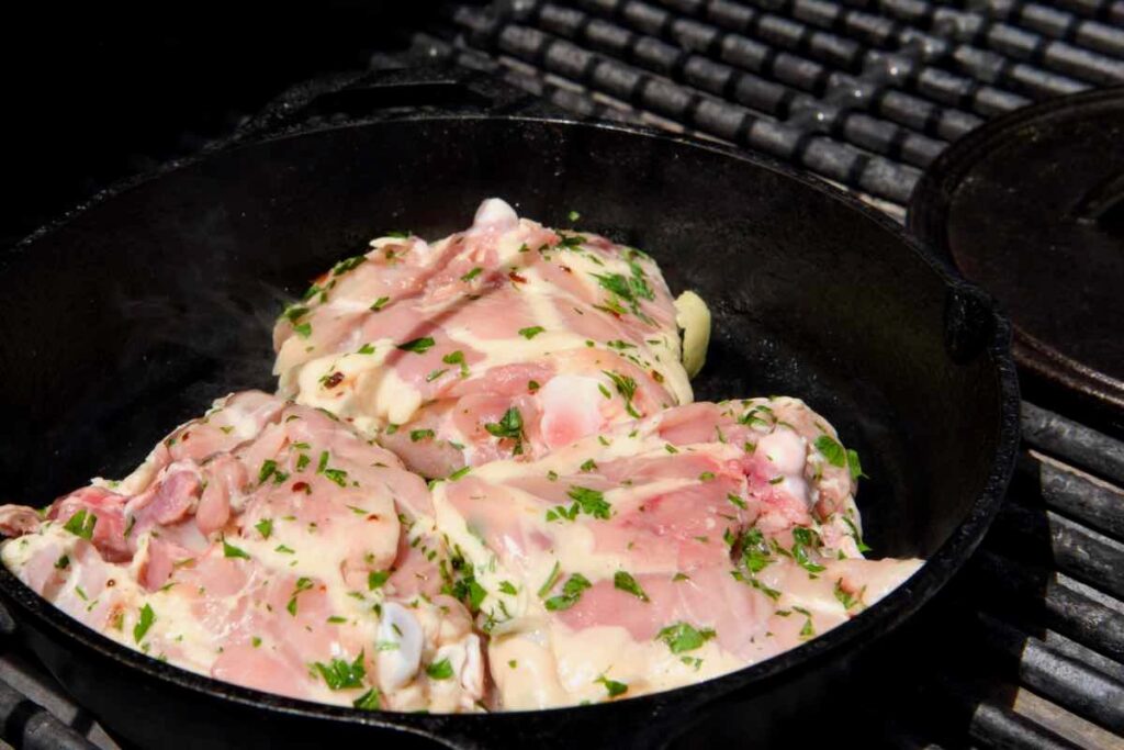 marinated chicken in cast iron skillet