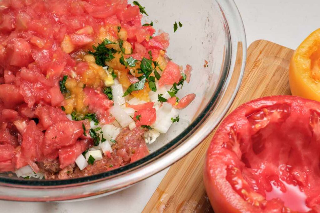 sausage rice mixture for filling which includes tomato pulp, rice, herb, and other aromatics