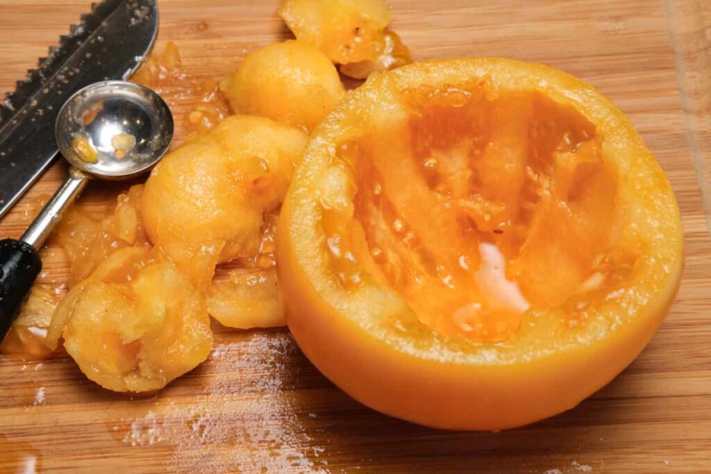 scoop out the tomato pulp, prep for baked stuffed tomato recipe